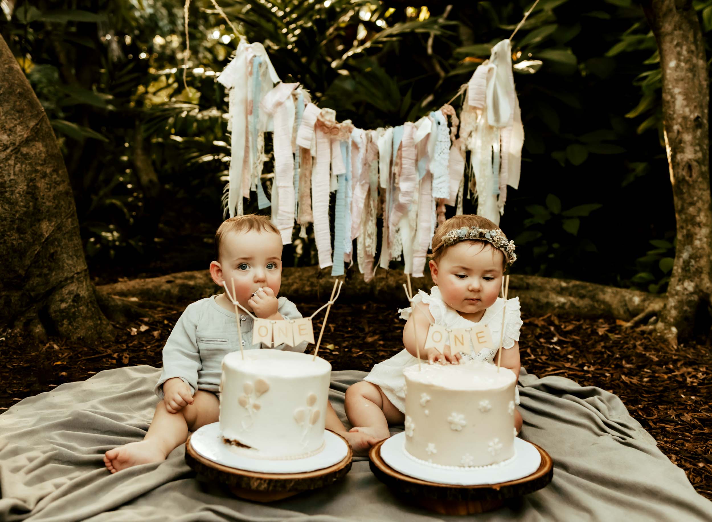 boy and girl twins outdoor cake smash