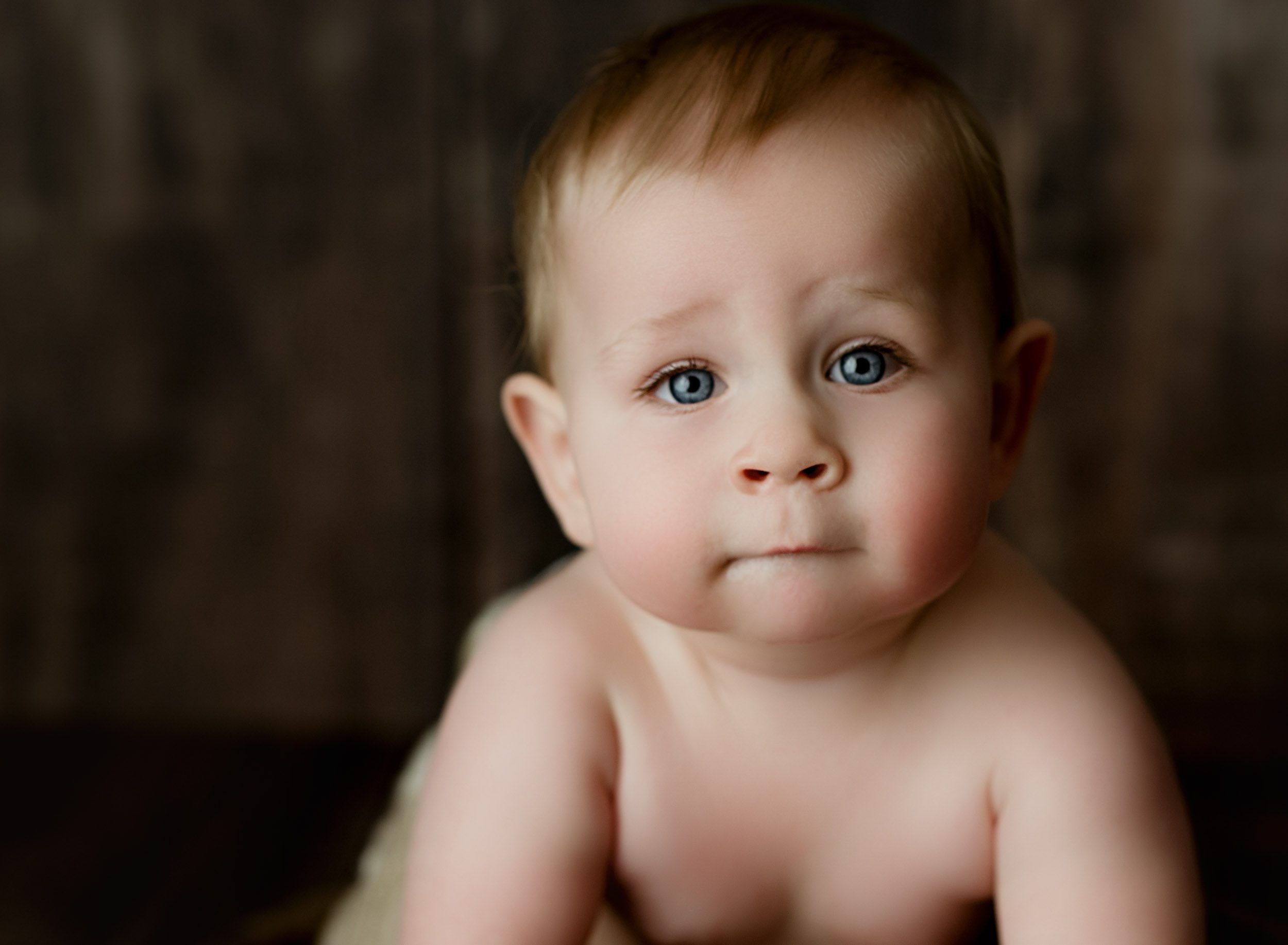 close up of the most gorgeous one year old with big blue eyes