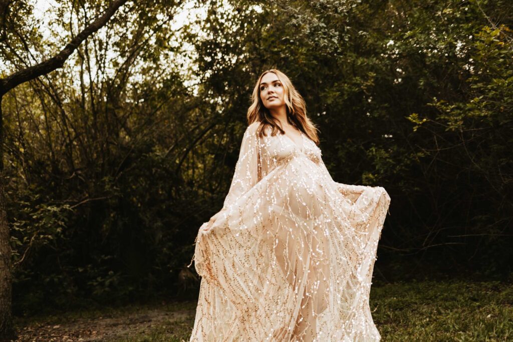 mom wearing beautiful flowy dress for her maternity photosession