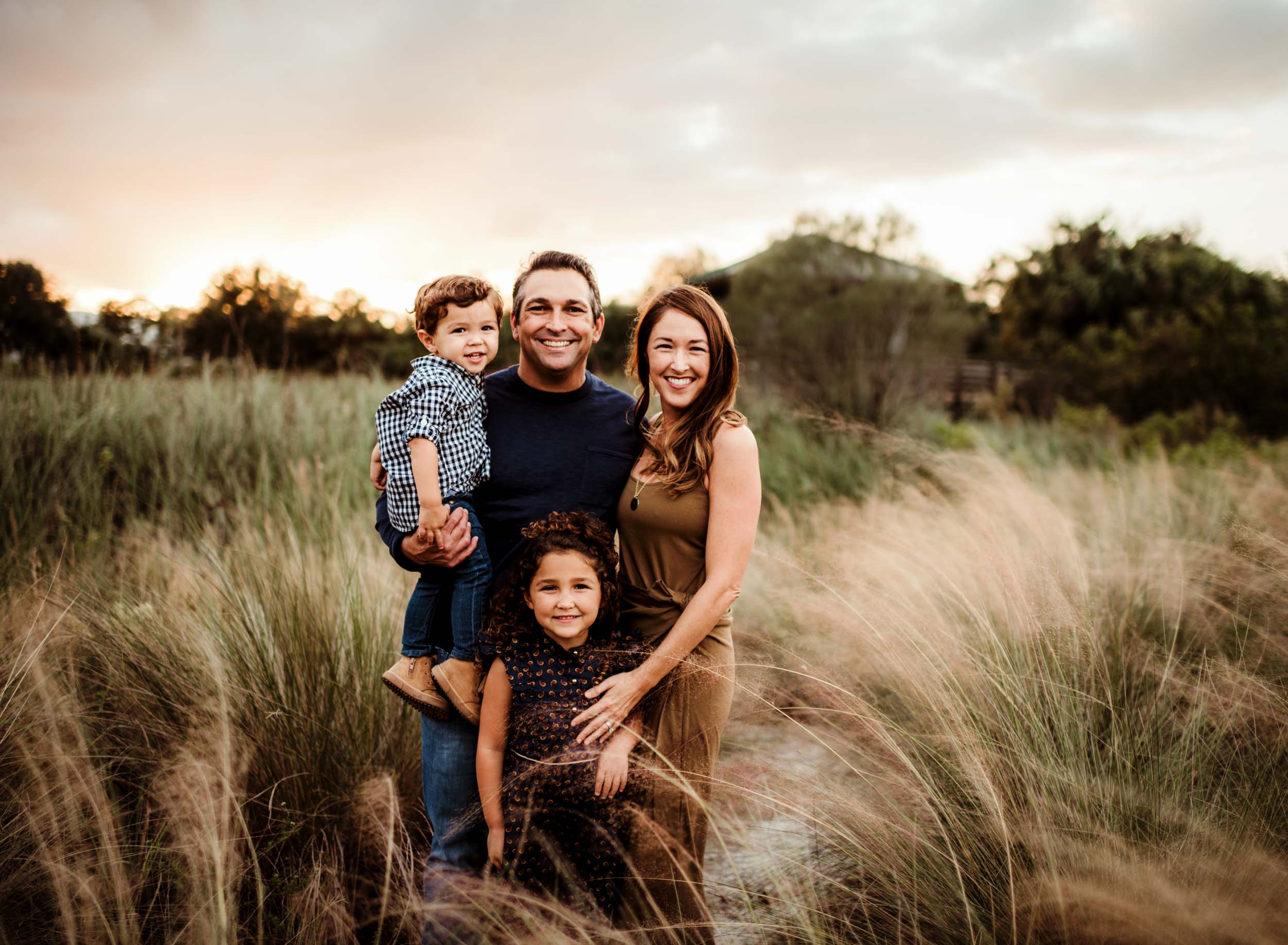 family of four hugging in fort lauderdale family photoshoot