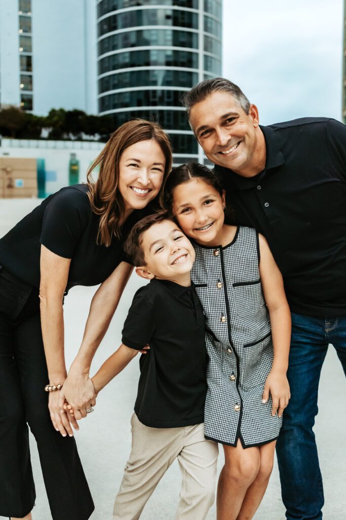 Family of four on rooftop parking garage in Fort Lauderdale, FL