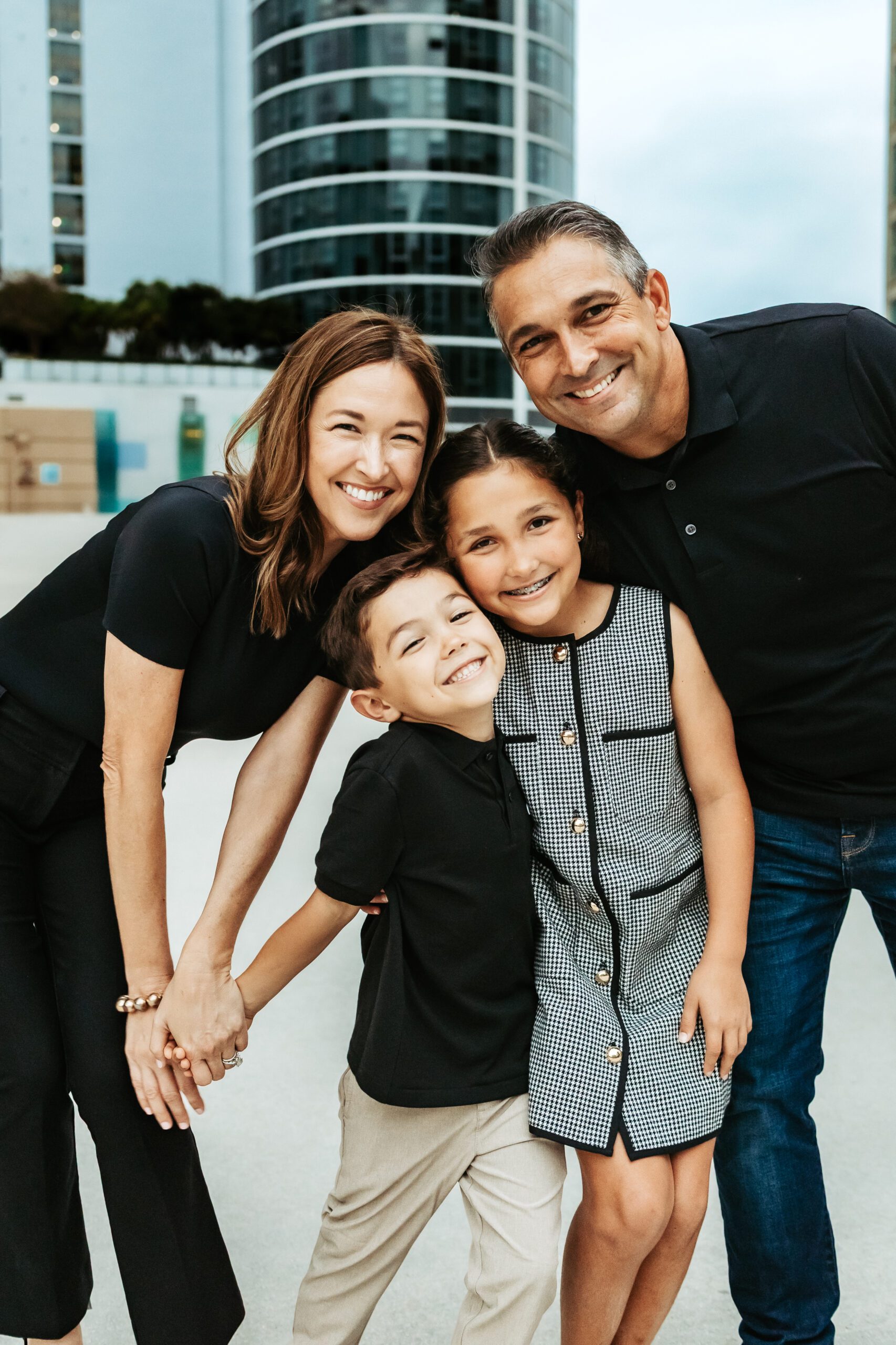 family of four standing together for family photos in Fort Lauderdale