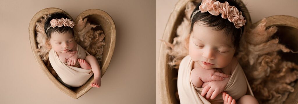 newborn baby girl in wooden heart bowl wrapped up in a knit blanket in a professional newborn photoshoot in Parkland