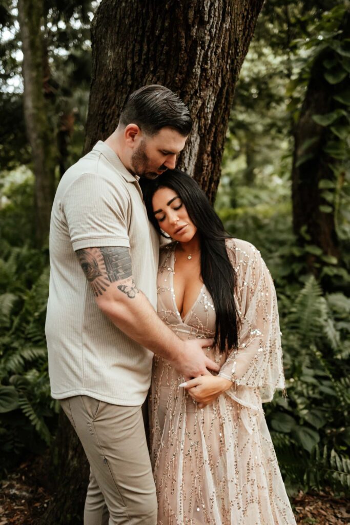 expectant couple embracing for maternity photos