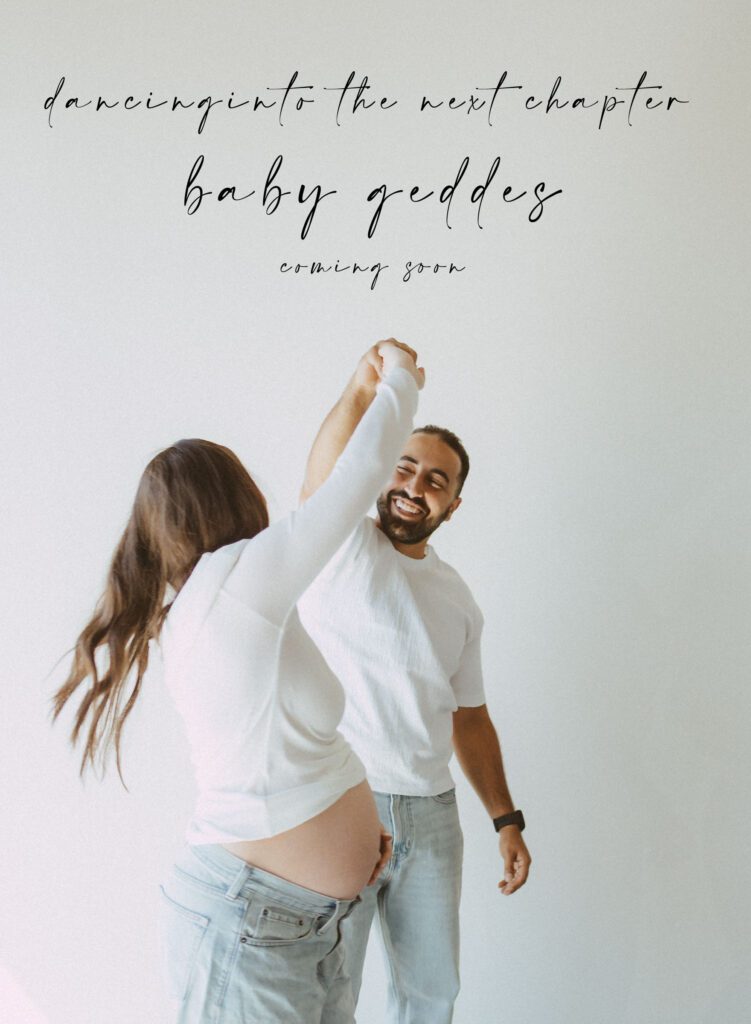 dad smiling and twirling expectant wife for the pregnancy announcement photos 