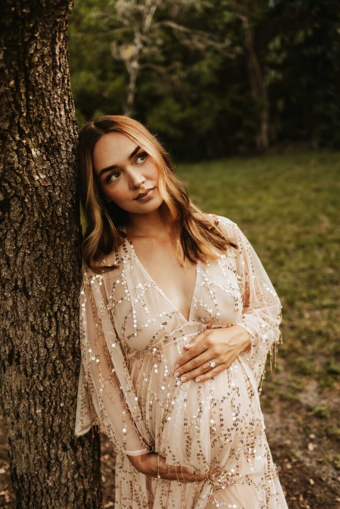 expecting mom in glam dress during pregnancy announcement photos shoot